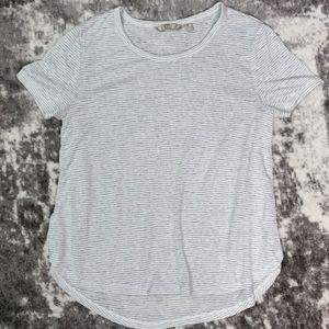 Athleta gray and white striped tee with rounded hem